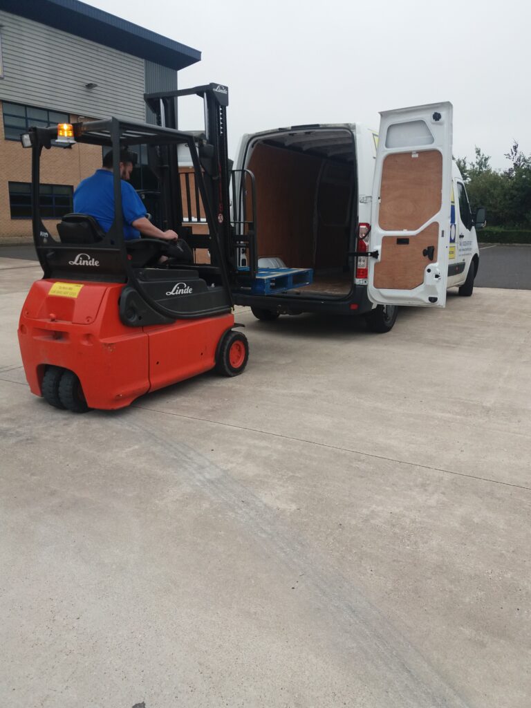 forklift driver loading a van